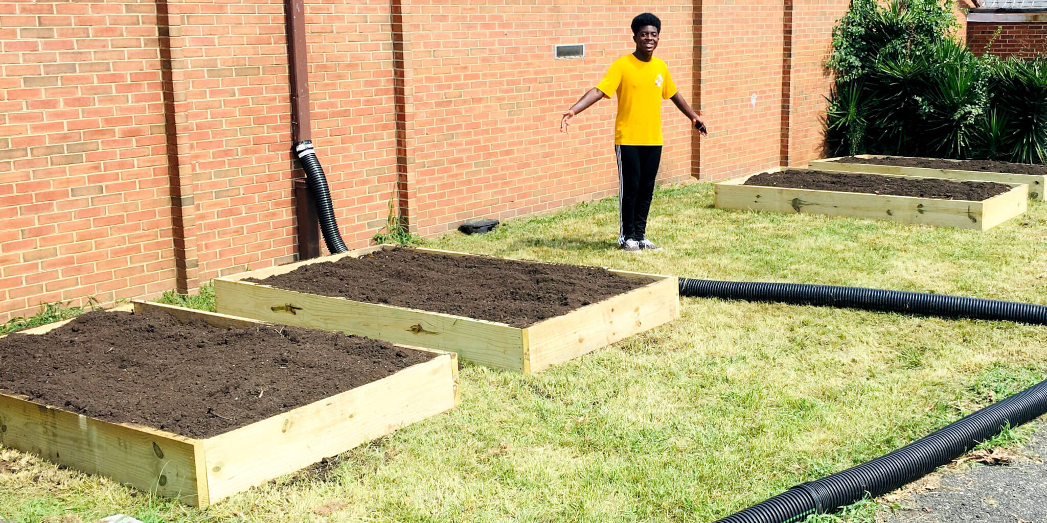 https://umcmission.org/wp-content/uploads/2021/12/IMG_E1753.JPG-Caleb-and-raised-beds.jpg