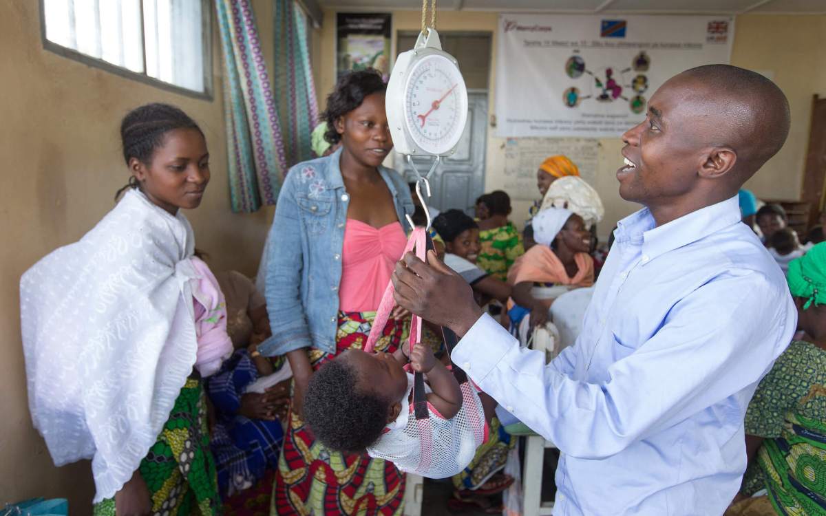 baby getting weighed at health center