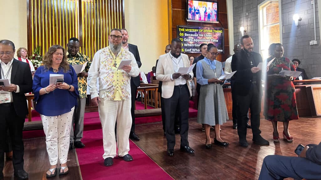 Newly commissioned missionaries in Nairobi, Kenya, recite the Wesleyan Covenant Prayer at Lavington United Church. (Photo: Susan Clark)